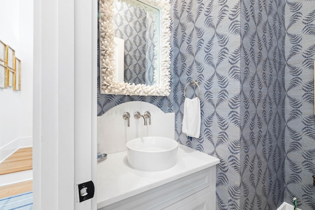 bathroom with hardwood / wood-style flooring and vanity