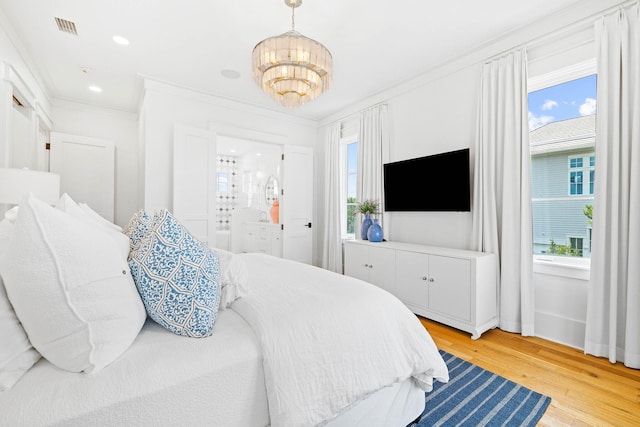 48 Paradise By The Sea Blvd, Inlet Beach, FL 32461 - bedroom with a chandelier, light wood-style floors, crown molding, and recessed lighting