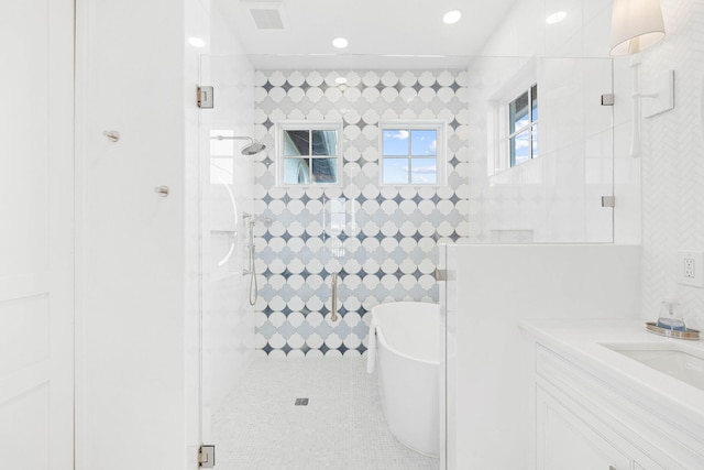 48 Paradise By The Sea Blvd, Inlet Beach, FL 32461 - bathroom with a tile shower, a freestanding bath, tile patterned floors, recessed lighting, and vanity