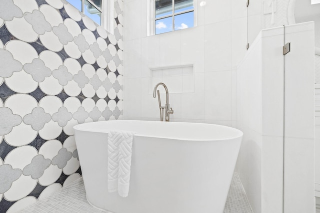 48 Paradise By The Sea Blvd, Inlet Beach, FL 32461 - bathroom featuring tile patterned flooring, a freestanding tub, tile walls, and a sink