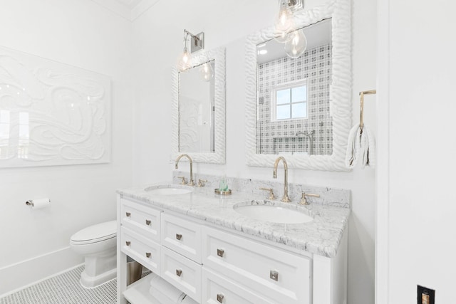 bathroom with crown molding, tile patterned flooring, vanity, and toilet