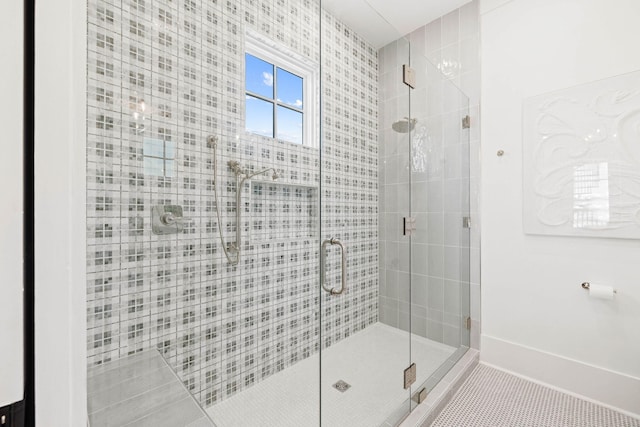 bathroom featuring walk in shower and tile patterned flooring