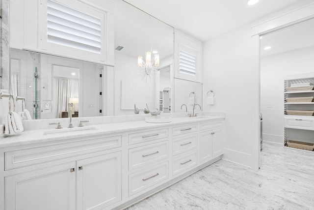 48 Paradise By The Sea Blvd, Inlet Beach, FL 32461 - bathroom with double vanity, a shower stall, baseboards, and wood finished floors