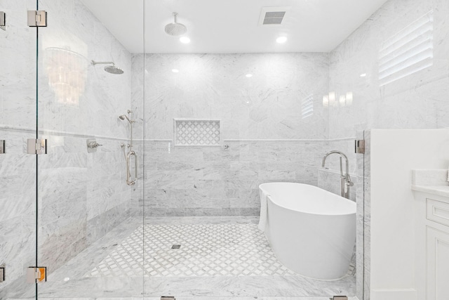 bathroom featuring vanity and separate shower and tub