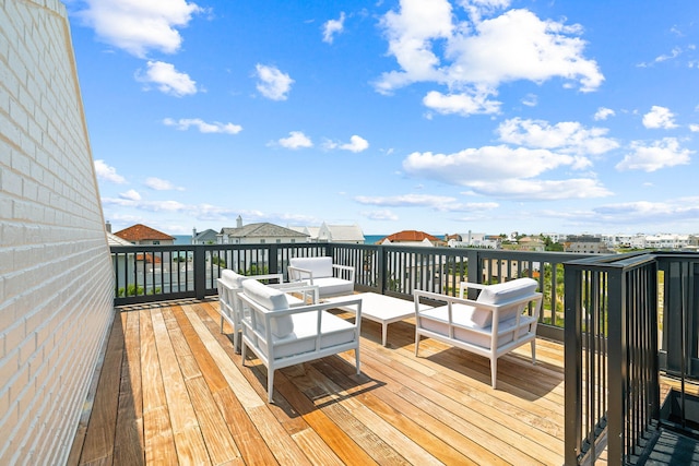 wooden deck with an outdoor living space