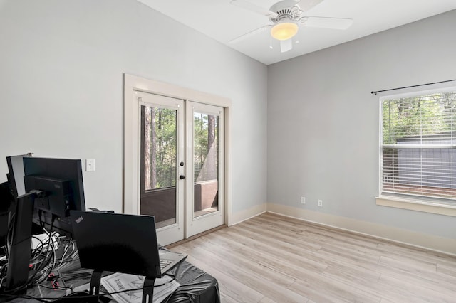 office space featuring light hardwood / wood-style floors and ceiling fan