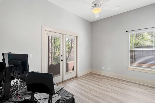 182 Pisces Dr, Santa Rosa Beach, FL 32459 - home office featuring plenty of natural light, light wood-style flooring, french doors, and a ceiling fan
