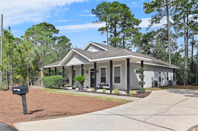 182 Pisces Dr, Santa Rosa Beach, FL 32459 - view of front of property featuring a porch, a shingled roof, and concrete driveway