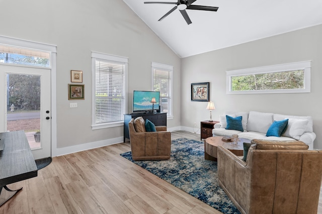 living room with high vaulted ceiling, light hardwood / wood-style floors, and ceiling fan