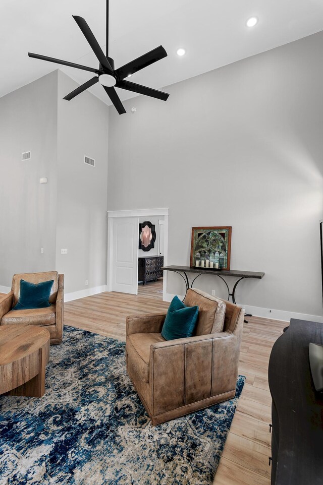 182 Pisces Dr, Santa Rosa Beach, FL 32459 - living room featuring ceiling fan, wood finished floors, baseboards, a towering ceiling, and recessed lighting