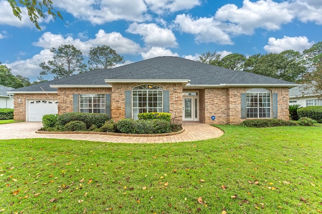 single story home featuring a front yard and a garage