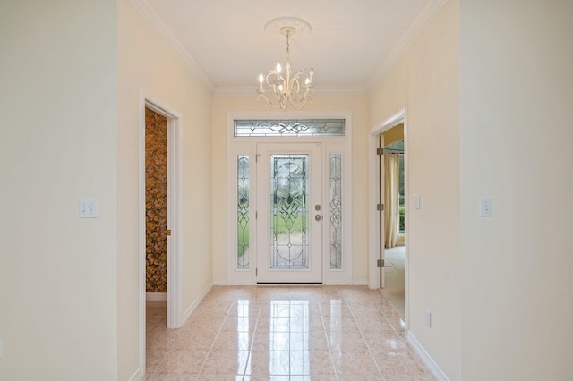 entrance foyer with ornamental molding and a notable chandelier