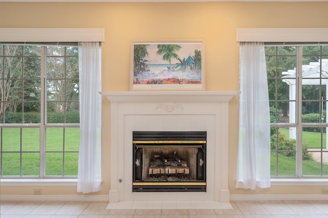 room details with a fireplace and tile patterned floors