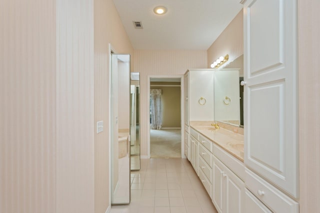 bathroom featuring tile patterned flooring and vanity