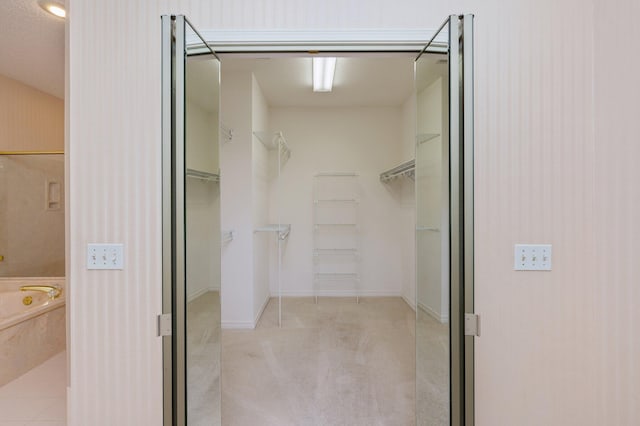 bathroom with a bathtub and a textured ceiling