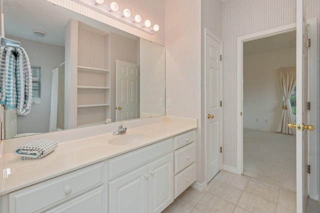 bathroom with tile patterned flooring and vanity