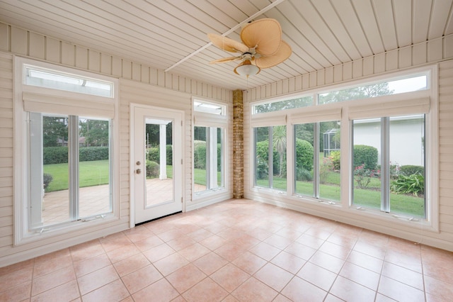 unfurnished sunroom featuring ceiling fan and wooden ceiling