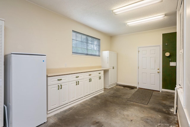 garage with white fridge