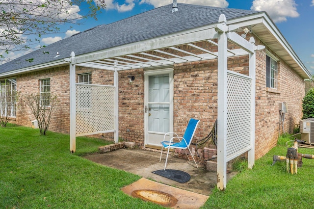 back of property with a lawn and central AC