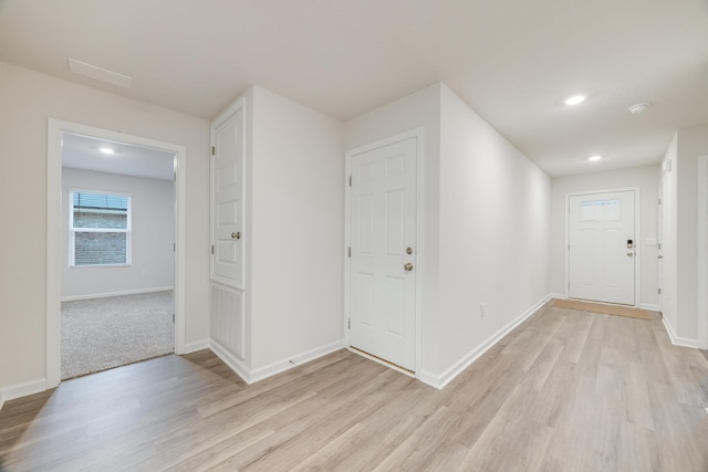 corridor featuring light hardwood / wood-style flooring