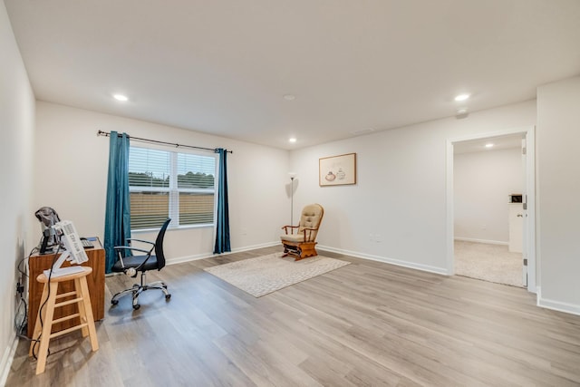 office space with light hardwood / wood-style flooring