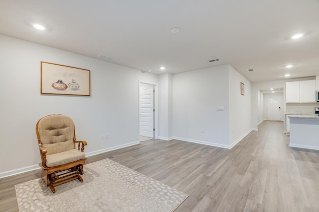 living area featuring light hardwood / wood-style flooring