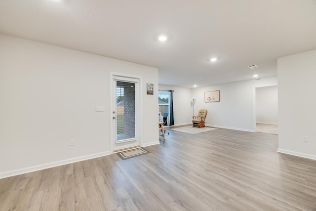 unfurnished living room with light hardwood / wood-style floors