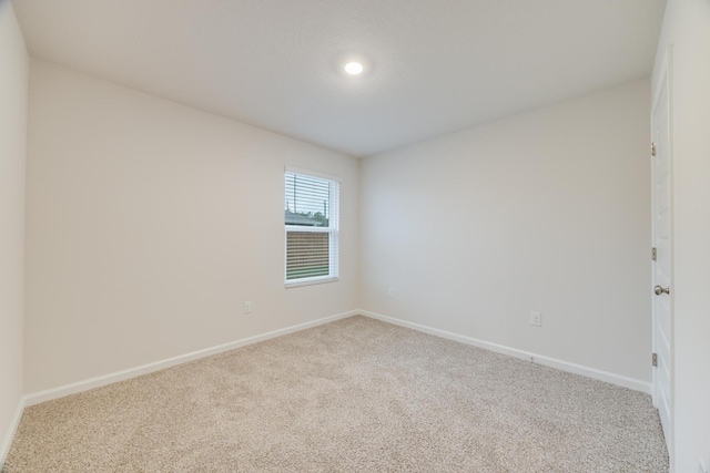 spare room with carpet floors