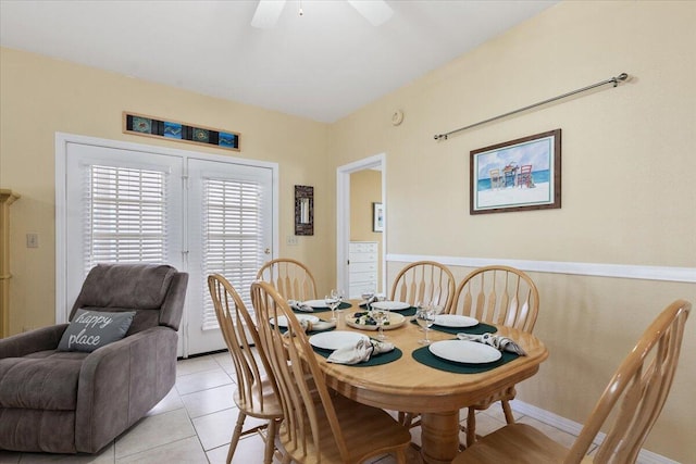 tiled dining area featuring ceiling fan