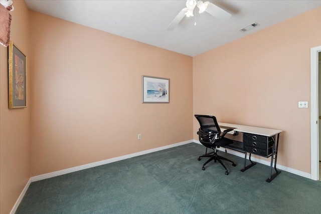 office with ceiling fan and dark carpet