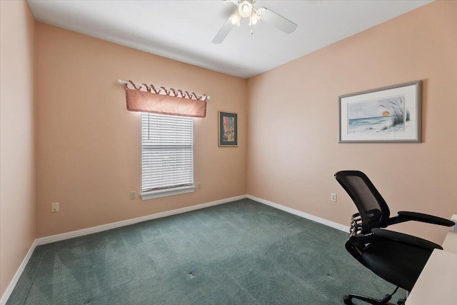 unfurnished office featuring carpet flooring and ceiling fan