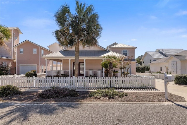 view of front of property with a garage and a porch