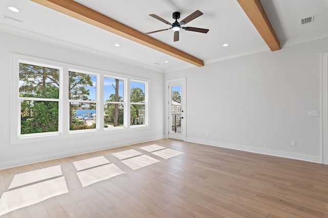 spare room with beamed ceiling, ceiling fan, and light hardwood / wood-style flooring