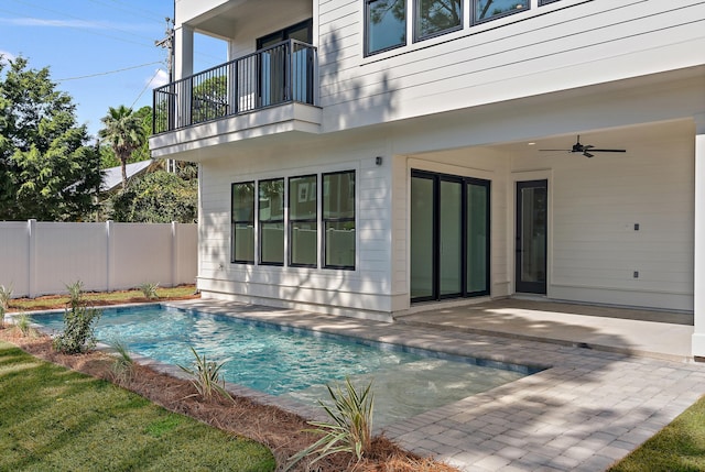 view of pool with a patio and ceiling fan