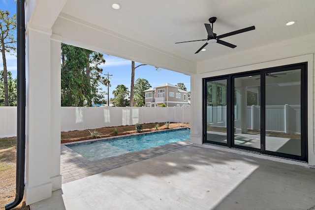 view of pool featuring a patio and ceiling fan