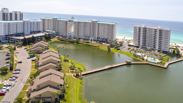 bird's eye view featuring a beach view and a water view