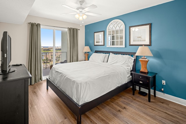 bedroom featuring ceiling fan, wood-type flooring, and access to outside