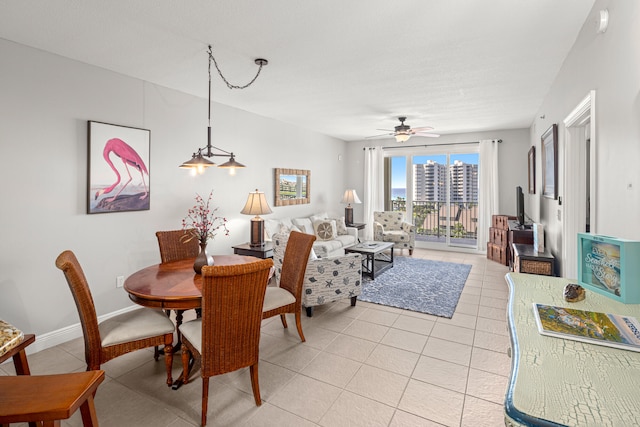 tiled dining space with ceiling fan