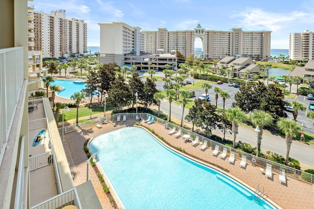 view of swimming pool with a water view