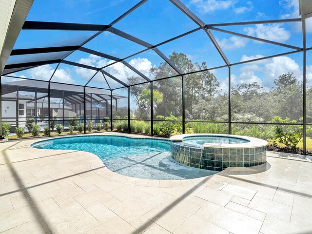 view of pool with a lanai, central AC, an in ground hot tub, and a patio area