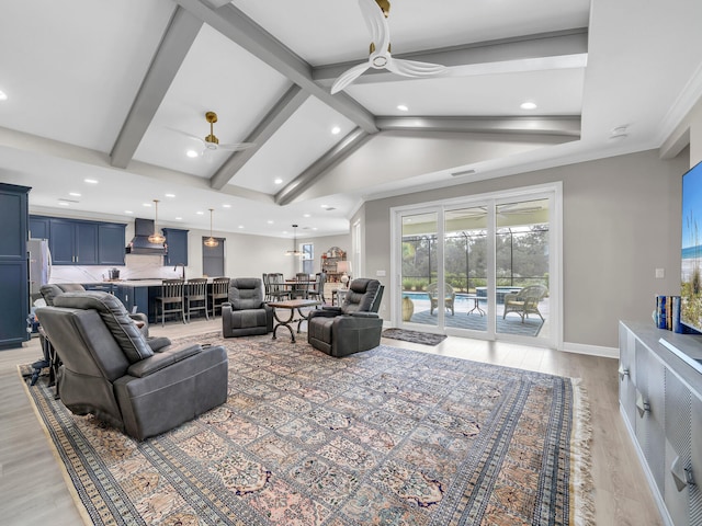 living room featuring lofted ceiling with beams, ceiling fan, and light hardwood / wood-style floors