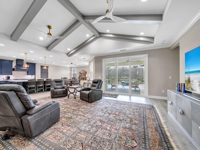 living room with ceiling fan, hardwood / wood-style floors, and a healthy amount of sunlight