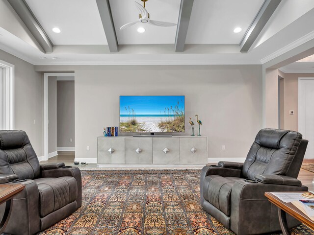 living room with ceiling fan, hardwood / wood-style flooring, ornamental molding, and beam ceiling