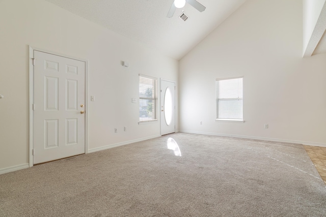 unfurnished room featuring ceiling fan, light colored carpet, and high vaulted ceiling