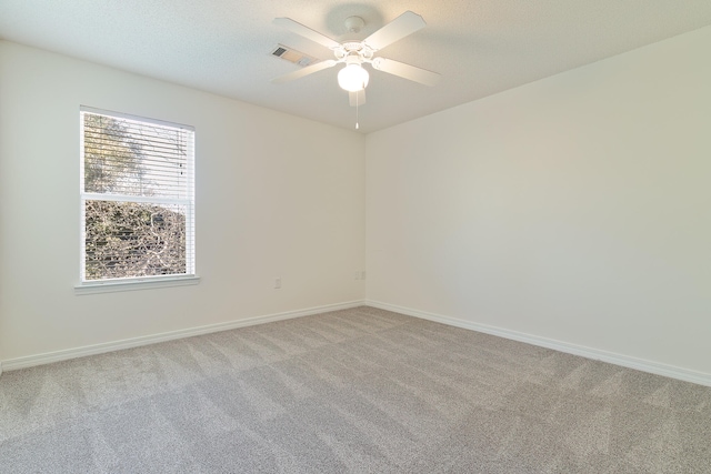 empty room featuring carpet and ceiling fan