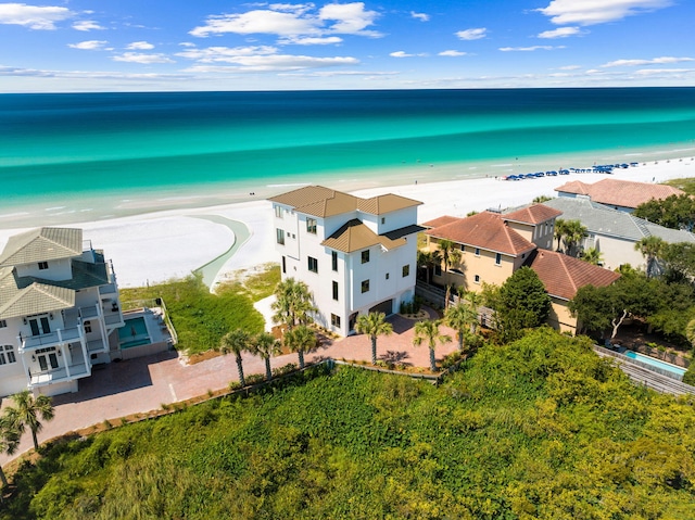 aerial view featuring a water view and a beach view