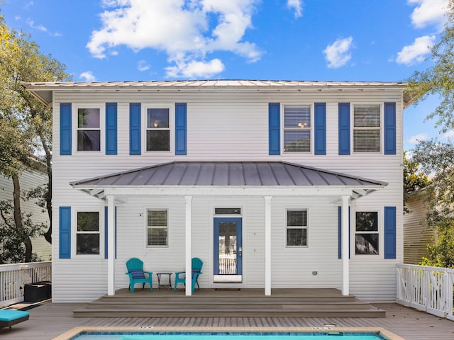 rear view of house with a wooden deck