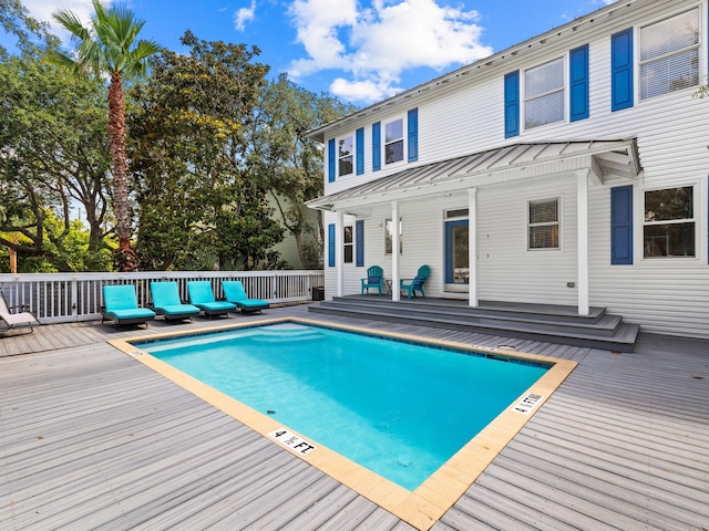 view of swimming pool with an outdoor hangout area and a wooden deck