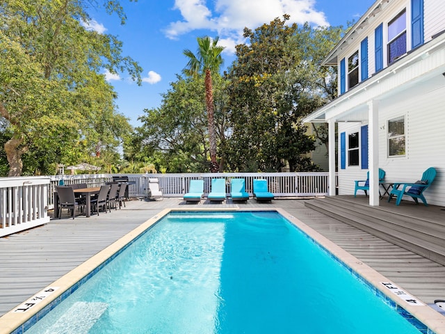 view of pool featuring a wooden deck