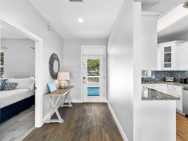 entrance foyer with dark hardwood / wood-style floors and sink